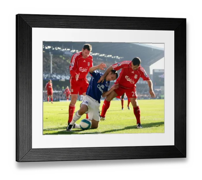 Framed Print : Osman vs Carragher and Mascherano: The Intense Rivalry of Everton vs Liverpool's Derby Match, 2007 - Everton's Leon Osman Faces Off Against Jamie Carragher and Javier Mascherano in the Everton v Liverpool Barclays Premier League Clash at Goodison Park Framed Print : Osman vs Carragher and Mascherano: The Intense Rivalry of Everton vs Liverpool's Derby Match, 2007 - Everton's Leon Osman Faces Off Against Jamie Carragher and Javier Mascherano in the Everton v Liverpool Barclays Premier League Clash at Goodison Park