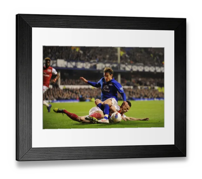 Framed Print : Everton vs. Arsenal: Jelavic vs. Koscielny - The Intense Battle for the Ball (Premier League, March 21, 2012)