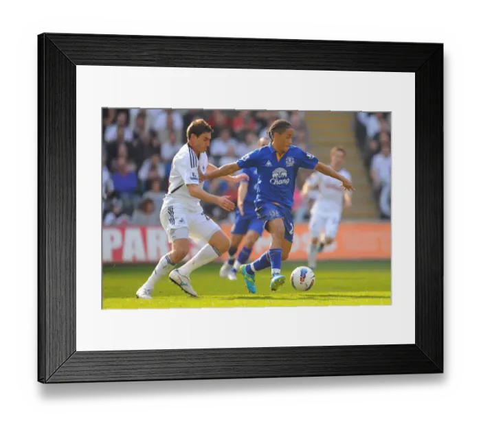 Framed Print : Intense Battle: Pienaar vs. Rangel at Swansea City vs. Everton, Barclays Premier League (24 March 2012, Liberty Stadium) Framed Print : Intense Battle: Pienaar vs. Rangel at Swansea City vs. Everton, Barclays Premier League (24 March 2012, Liberty Stadium)