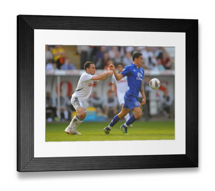 Framed Print : Intense Rivalry: Britton vs. Cahill - Swansea City vs. Everton (Premier League Clash, 24 March 2012, Liberty Stadium) Framed Print : Intense Rivalry: Britton vs. Cahill - Swansea City vs. Everton (Premier League Clash, 24 March 2012, Liberty Stadium)