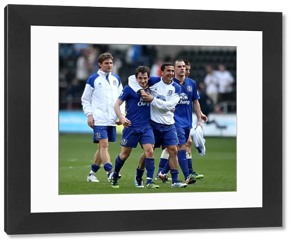 Everton's Triumphant Quartet: Tim Cahill, Nikica Jelavic, Darron Gibson, and Leighton Baines Celebrate Victory over Swansea City (24 March 2012)