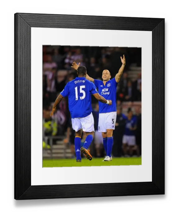 Framed Print : Everton's Glory: Distin and Heitinga Celebrate FA Cup Sixth Round Replay Victory over Sunderland Framed Print : Everton's Glory: Distin and Heitinga Celebrate FA Cup Sixth Round Replay Victory over Sunderland