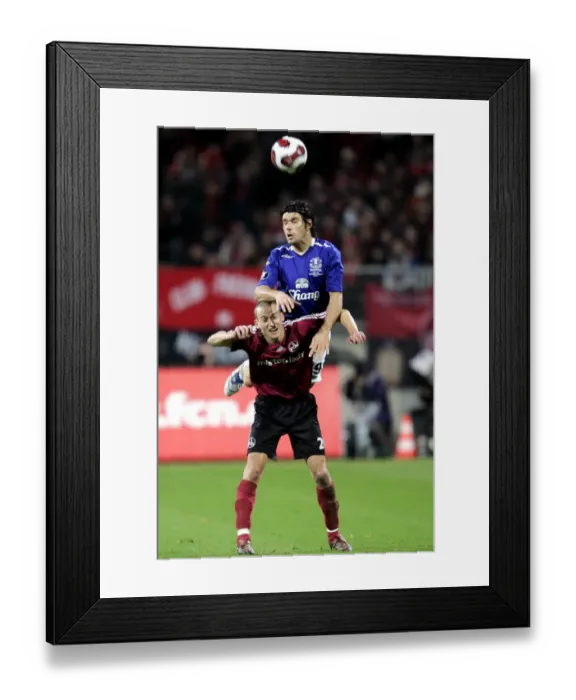 Framed Print : Football - FC Nurnberg v Everton UEFA Cup Group Stage - Second Round Matchday Two Group A - EasyCredit-Stadion, Nurnberg, Germany - 8 / 11 / 07 Evertons Nuno Valente in action with Nurnbergs Peer Kluge (bottom) Mandatory Credit: Action Images / Keith Framed Print : Football - FC Nurnberg v Everton UEFA Cup Group Stage - Second Round Matchday Two Group A - EasyCredit-Stadion, Nurnberg, Germany - 8 / 11 / 07 Evertons Nuno Valente in action with Nurnbergs Peer Kluge (bottom) Mandatory Credit: Action Images / Keith