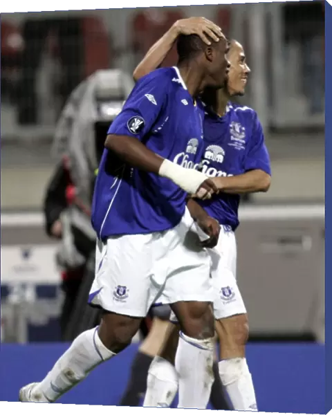 Football - FC Nurnberg v Everton UEFA Cup Group Stage - Second Round Matchday Two Group A - EasyCredit-Stadion, Nurnberg, Germany - 8  /  11  /  07 Evertons Victor Anichebe (L) celebrates scoring his sides second goal with Steven Pienaar (R) Mandatory Credit: Action Images  /  Keith