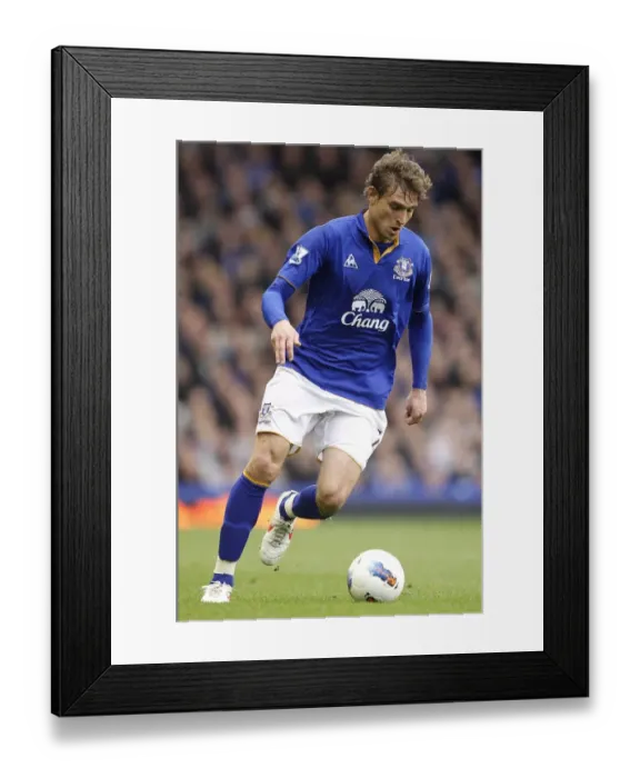Framed Print : Nikica Jelavic's Last-Minute Thriller: Everton Edge Past West Bromwich Albion in Premier League Drama (31 March 2012)
