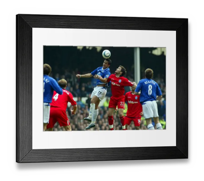 Framed Print : Tim Cahill wins a header Framed Print : Tim Cahill wins a header