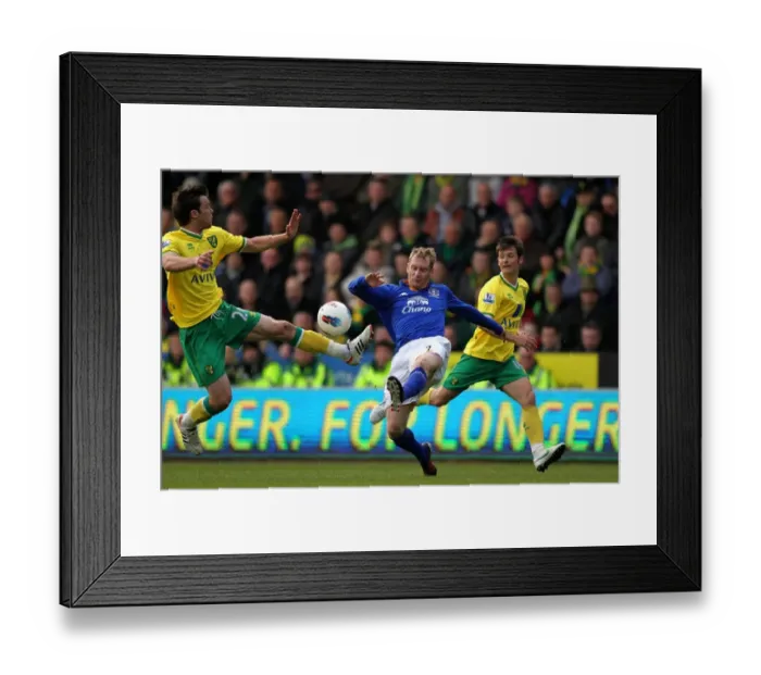 Framed Print : Battle for the Ball: Hibbert vs Howson - Everton vs Norwich City Rivalry in the Premier League (07 April 2012, Carrow Road) Framed Print : Battle for the Ball: Hibbert vs Howson - Everton vs Norwich City Rivalry in the Premier League (07 April 2012, Carrow Road)