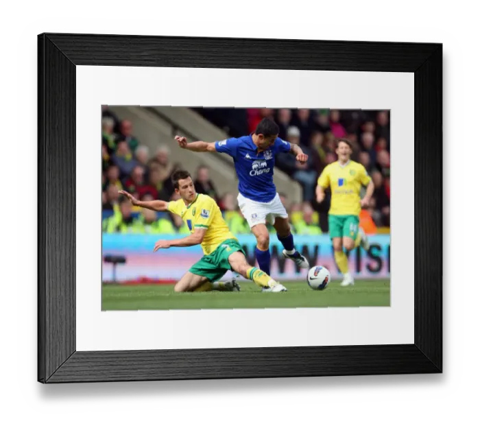 Framed Print : Tim Cahill vs. Adam Drury: A Premier League Battle at Carrow Road (April 2012) Framed Print : Tim Cahill vs. Adam Drury: A Premier League Battle at Carrow Road (April 2012)
