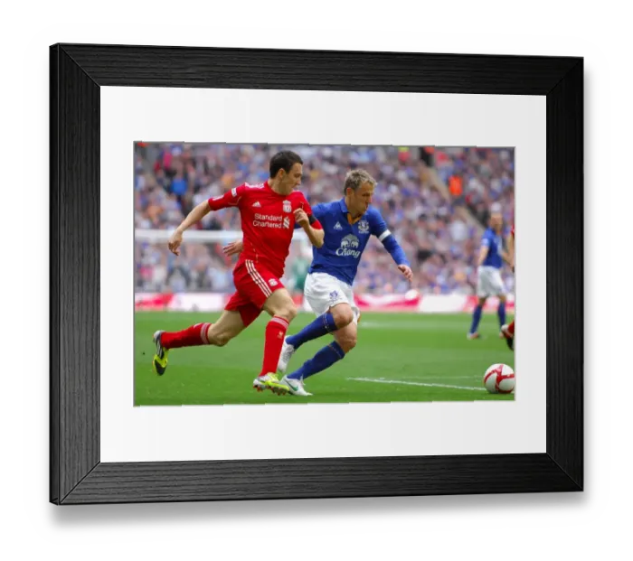 Framed Print : Everton vs Liverpool FA Cup Semi-Final Showdown: Neville vs Downing at Wembley Stadium - A Riveting Battle for the Ball Framed Print : Everton vs Liverpool FA Cup Semi-Final Showdown: Neville vs Downing at Wembley Stadium - A Riveting Battle for the Ball