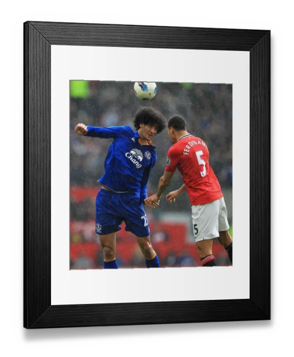 Framed Print : Intense Rivalry: Ferdinand vs. Fellaini - Battle for Ball (April 2012, Old Trafford) Framed Print : Intense Rivalry: Ferdinand vs. Fellaini - Battle for Ball (April 2012, Old Trafford)