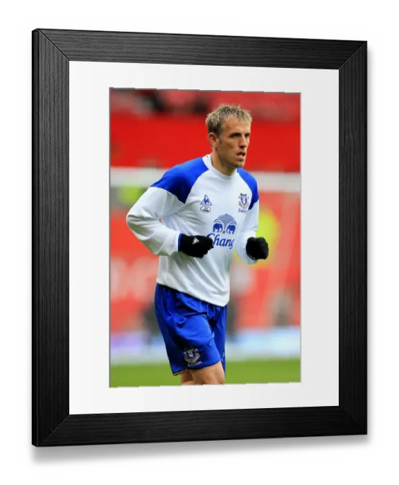 Framed Print : Everton vs Manchester United Showdown: Phil Neville Returns to Old Trafford (BPL Rivalry, 2012)