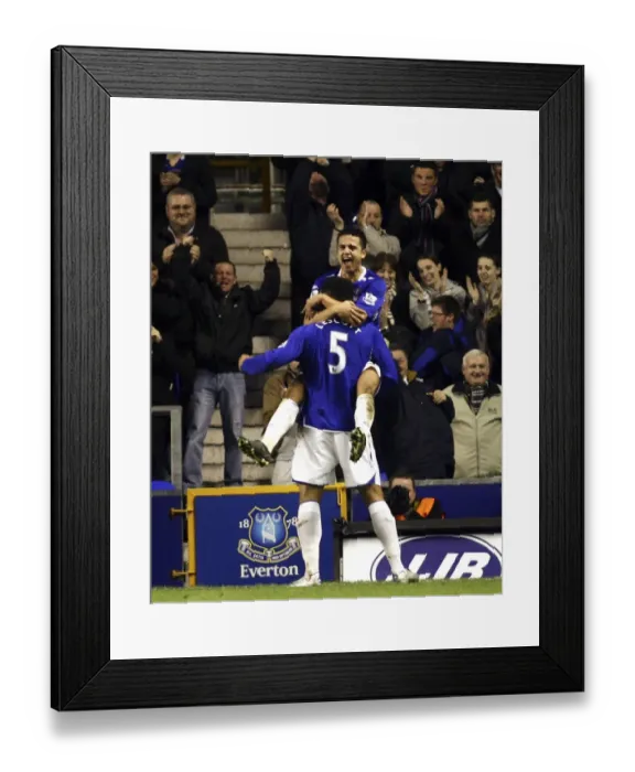 Framed Print : Everton's Tim Cahill and Joleon Lescott Celebrate Second Goal Against Bolton Wanderers (2007) Framed Print : Everton's Tim Cahill and Joleon Lescott Celebrate Second Goal Against Bolton Wanderers (2007)