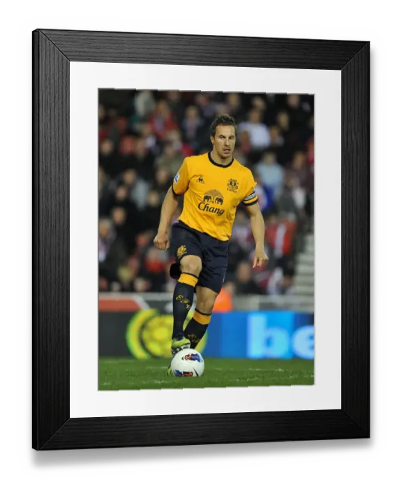 Framed Print : Everton's Phil Jagielka Leads the Charge Against Stoke City at Britannia Stadium (May 2012, Barclays Premier League) Framed Print : Everton's Phil Jagielka Leads the Charge Against Stoke City at Britannia Stadium (May 2012, Barclays Premier League)