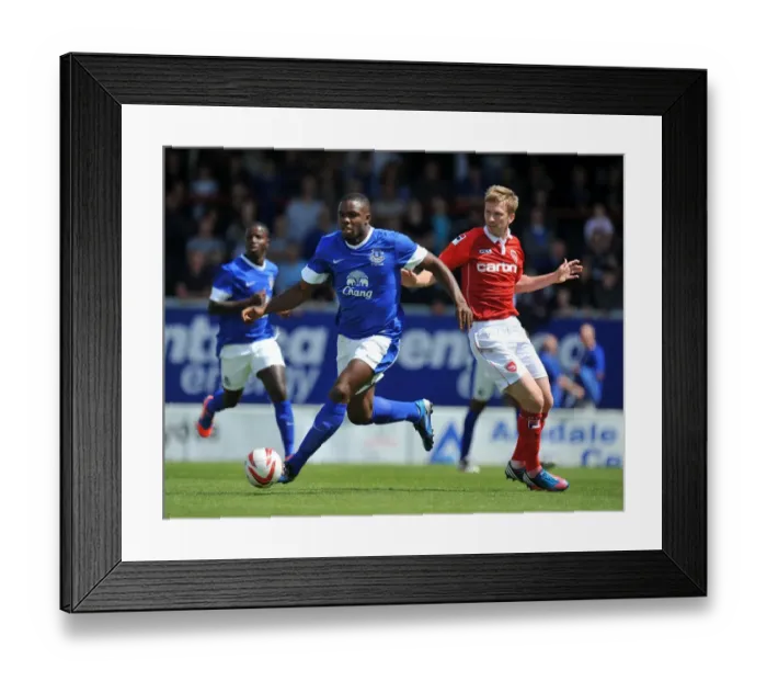 Framed Print : Clash at Globe Arena: Everton's Victor Anichebe vs Morecambe's Andy Wright