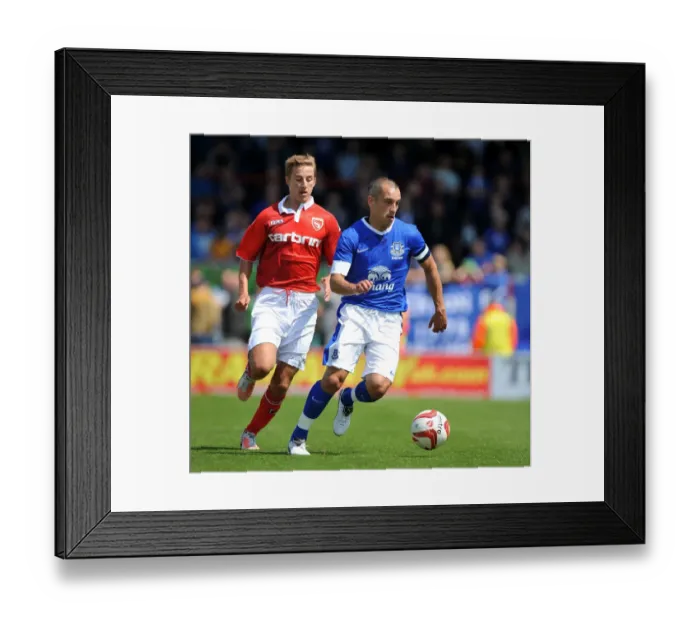 Framed Print : Leon Osman's Powerful Run: Everton Star Overpowers Morecambe Midfield in Pre-Season Friendly Framed Print : Leon Osman's Powerful Run: Everton Star Overpowers Morecambe Midfield in Pre-Season Friendly