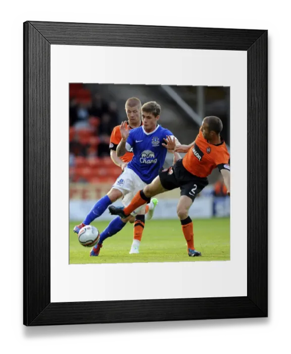 Framed Print : Battle for the Ball: McAleny vs. Dillon - Pre-Season Clash at Tannadice Park Framed Print : Battle for the Ball: McAleny vs. Dillon - Pre-Season Clash at Tannadice Park