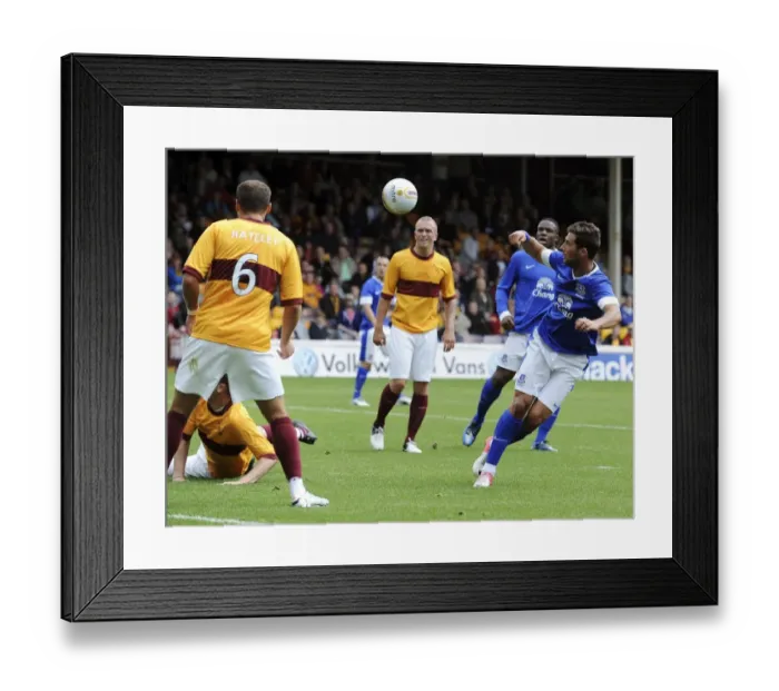 Framed Print : Everton's Vellios Aiming for the Net: Pre-Season Clash vs Motherwell at Fir Park Stadium Framed Print : Everton's Vellios Aiming for the Net: Pre-Season Clash vs Motherwell at Fir Park Stadium