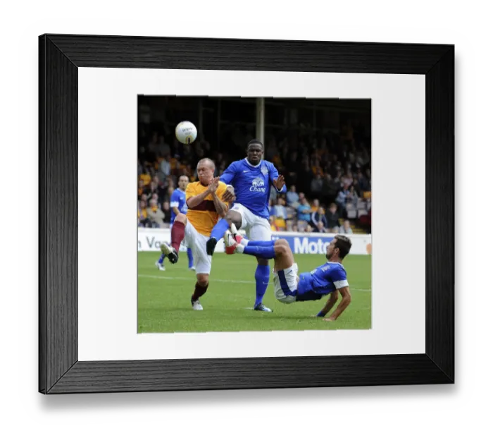 Framed Print : Anichebe and Vellios vs. Law: Everton's Star Forwards Face Off in Pre-Season Clash at Fir Park Stadium Framed Print : Anichebe and Vellios vs. Law: Everton's Star Forwards Face Off in Pre-Season Clash at Fir Park Stadium