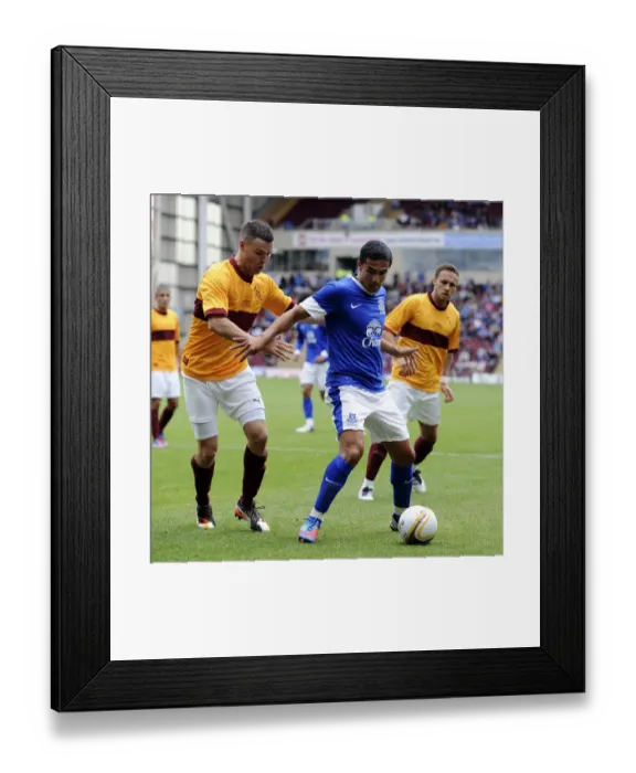Framed Print : Intense Clash: Tim Cahill vs. Simon Ramsden - Motherwell v Everton Pre-Season Friendly at Fir Park Stadium Framed Print : Intense Clash: Tim Cahill vs. Simon Ramsden - Motherwell v Everton Pre-Season Friendly at Fir Park Stadium