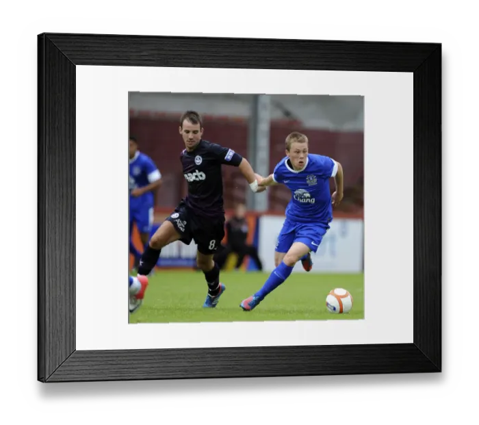 Framed Print : Everton's George Green vs. Partick Thistle's Sean Welsh: A Fierce Pre-Season Rivalry at Firhill Stadium Framed Print : Everton's George Green vs. Partick Thistle's Sean Welsh: A Fierce Pre-Season Rivalry at Firhill Stadium