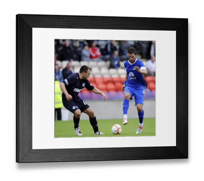 Framed Print : Intense Clash: Vellios vs. Ballatoni - Everton's Pre-Season Battle at Firhill Stadium Framed Print : Intense Clash: Vellios vs. Ballatoni - Everton's Pre-Season Battle at Firhill Stadium
