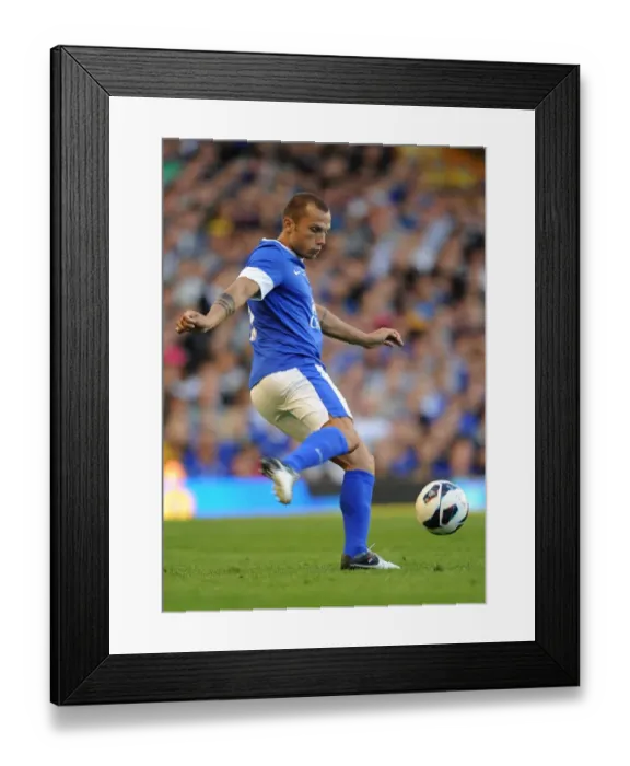 Framed Print : John Heitinga Leads Everton in Pre-Season Friendly Against AEK Athens at Goodison Park