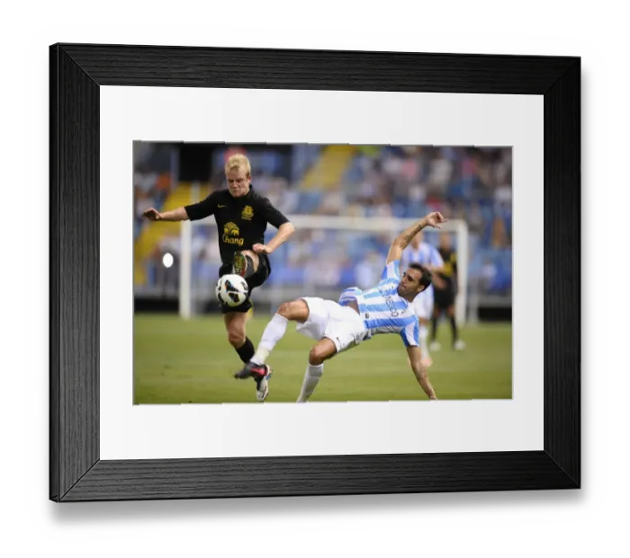 Framed Print : Jelavic vs. Gamez: A Clash at La Rosaleda - Everton vs. Malaga CF Pre-Season Friendly Framed Print : Jelavic vs. Gamez: A Clash at La Rosaleda - Everton vs. Malaga CF Pre-Season Friendly