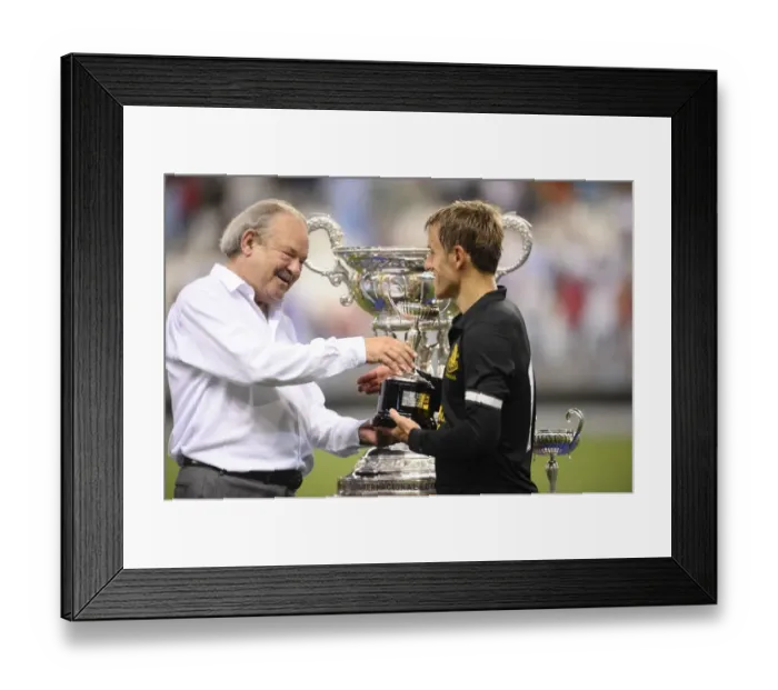 Framed Print : Everton's Phil Neville Celebrates Pre-Season Victory over Malaga CF with Trophy
