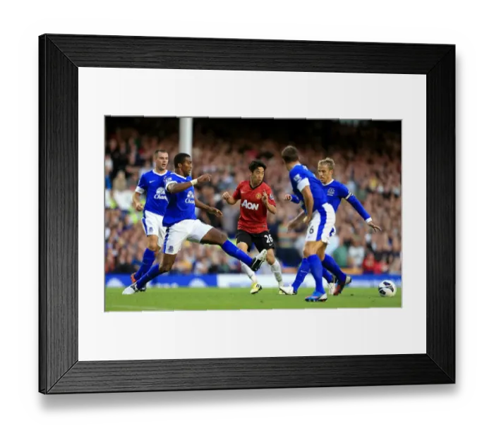 Framed Print : Clash at Goodison Park: Everton vs Manchester United - Kagawa vs Distin & Neville: A Battle of Midfield Masters (Everton 1 - Manchester United 0, August 2012) Framed Print : Clash at Goodison Park: Everton vs Manchester United - Kagawa vs Distin & Neville: A Battle of Midfield Masters (Everton 1 - Manchester United 0, August 2012)