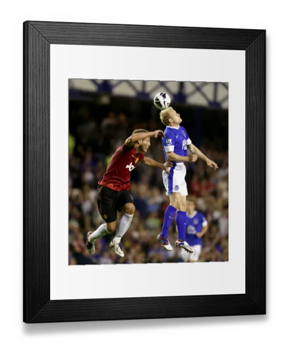 Framed Print : Vidic vs. Naismith: A Premier League Battle at Goodison Park - Everton vs. Manchester United (1-0 in Favor of Manchester United) Framed Print : Vidic vs. Naismith: A Premier League Battle at Goodison Park - Everton vs. Manchester United (1-0 in Favor of Manchester United)