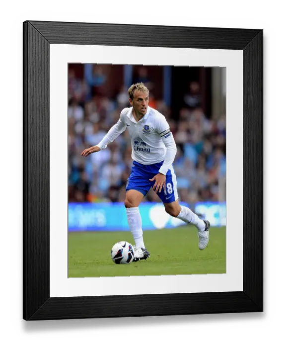 Framed Print : Everton's Triumph: Phil Neville Leads the Toffees to a 3-1 Victory over Aston Villa (25-08-2012) Framed Print : Everton's Triumph: Phil Neville Leads the Toffees to a 3-1 Victory over Aston Villa (25-08-2012)