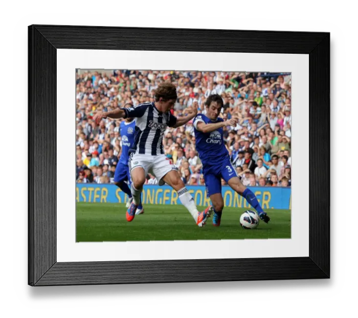 Framed Print : Baines vs. Jones: A Tussle in the Premier League Clash between Everton and West Bromwich Albion (01-09-2012) Framed Print : Baines vs. Jones: A Tussle in the Premier League Clash between Everton and West Bromwich Albion (01-09-2012)
