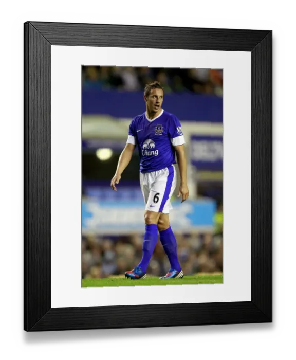 Framed Print : Phil Jagielka's Triumphant Celebration: Everton's 5-0 Capital One Cup Victory over Leyton Orient (2012)
