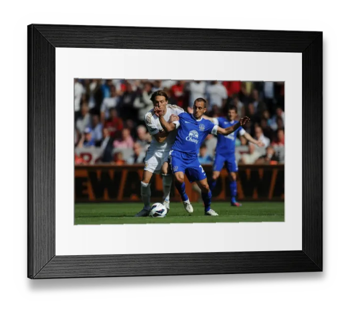 Framed Print : Battle for the Ball: Michu vs. Osman - Swansea City vs. Everton's Premier League Clash (September 22, 2012: Liberty Stadium) Framed Print : Battle for the Ball: Michu vs. Osman - Swansea City vs. Everton's Premier League Clash (September 22, 2012: Liberty Stadium)