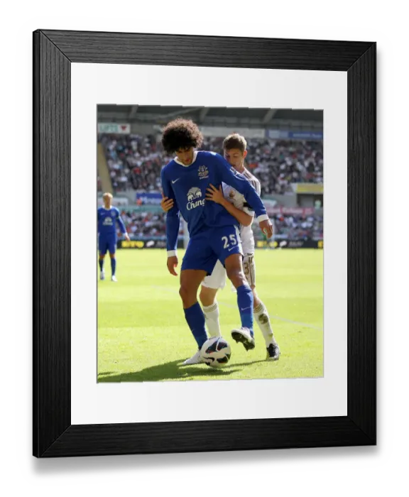Framed Print : Everton's Triumph at Liberty Stadium: Fellaini vs. Davies in the Premier League's Intense Battle (September 22, 2012) Framed Print : Everton's Triumph at Liberty Stadium: Fellaini vs. Davies in the Premier League's Intense Battle (September 22, 2012)