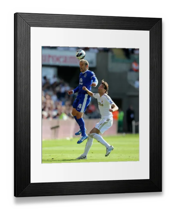 Framed Print : Phil Neville vs Miguel Michu: Everton's 3-0 Victory over Swansea City (Barclays Premier League, Liberty Stadium, September 22, 2012) Framed Print : Phil Neville vs Miguel Michu: Everton's 3-0 Victory over Swansea City (Barclays Premier League, Liberty Stadium, September 22, 2012)