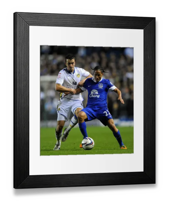 Framed Print : Battling for Control: Pugh vs. Pienaar in the Intense Capital One Cup Clash between Leeds United and Everton Framed Print : Battling for Control: Pugh vs. Pienaar in the Intense Capital One Cup Clash between Leeds United and Everton