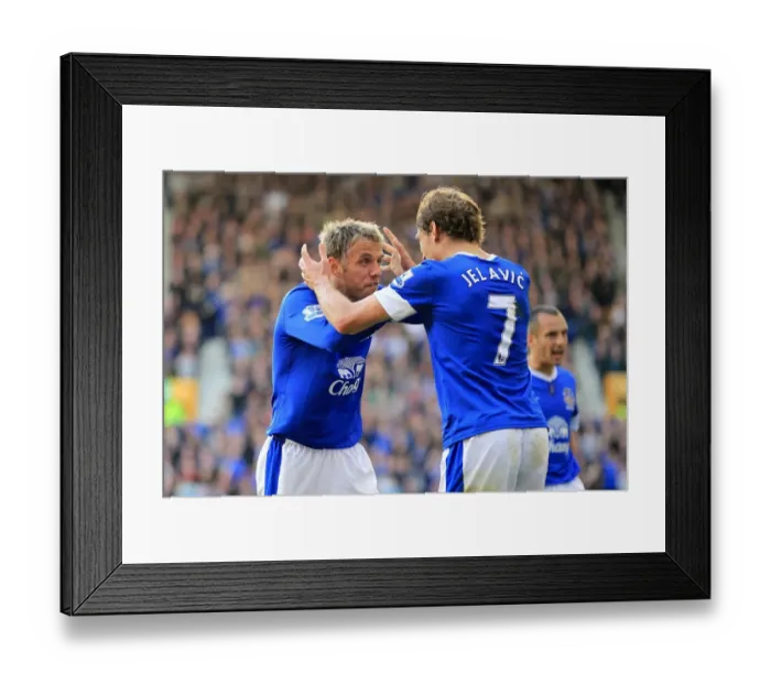 Framed Print : Everton's Jelavic and Neville: A Celebratory Moment as Everton Takes a 3-1 Lead over Southampton (September 29, 2012, Goodison Park)