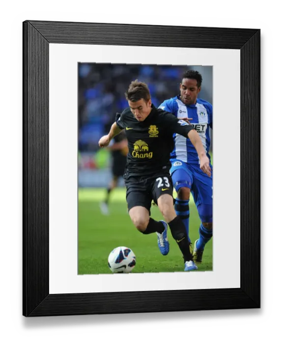 Framed Print : Battle for Ball Possession: Seamus Coleman vs. Jean Beausejour - Wigan Athletic vs. Everton (2-2 Stalemate, DW Stadium, October 6, 2012) Framed Print : Battle for Ball Possession: Seamus Coleman vs. Jean Beausejour - Wigan Athletic vs. Everton (2-2 Stalemate, DW Stadium, October 6, 2012)