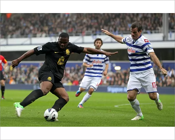 Anichebe vs. Nelsen: A Tight Battle for the Goal - Everton vs. Queens Park Rangers, Premier League