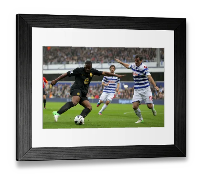 Framed Print : Anichebe vs. Nelsen: A Tight Battle for the Goal - Everton vs. Queens Park Rangers, Premier League