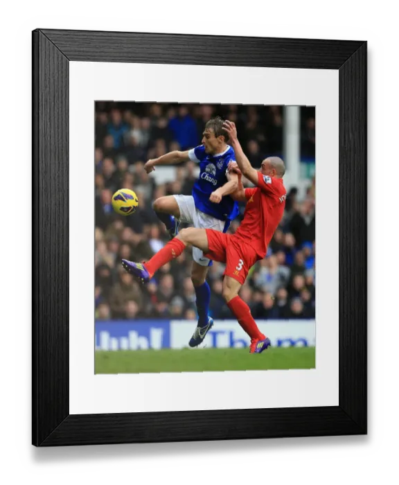 Framed Print : Battle for Supremacy: Jelavic vs Enrique at Goodison Park - Everton vs Liverpool (Barclays Premier League)