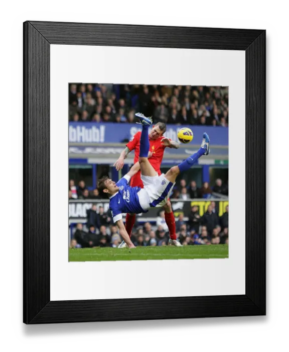Framed Print : Aerial Clash: Jelavic vs. Agger at Goodison Park (Everton vs. Liverpool, 28-10-2012) Framed Print : Aerial Clash: Jelavic vs. Agger at Goodison Park (Everton vs. Liverpool, 28-10-2012)