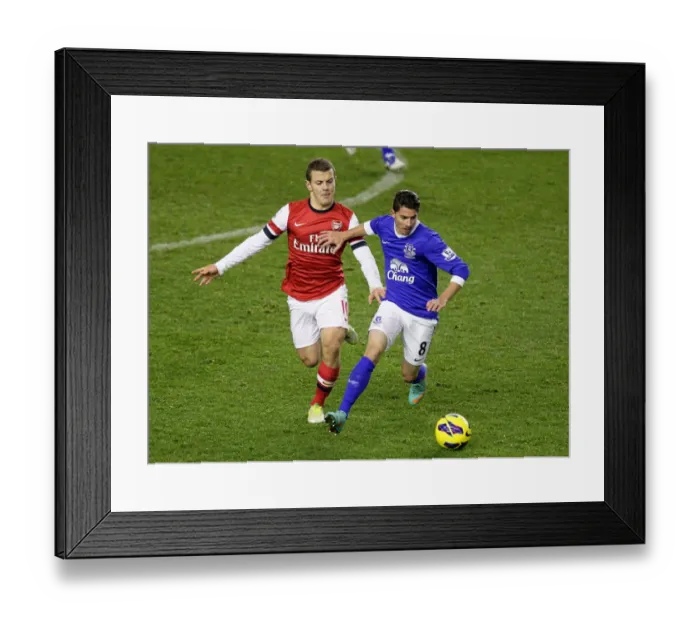 Framed Print : Battle for the Ball: Wilshere vs. Oviedo - Everton vs. Arsenal Rivalry in the Premier League (1-1) Framed Print : Battle for the Ball: Wilshere vs. Oviedo - Everton vs. Arsenal Rivalry in the Premier League (1-1)