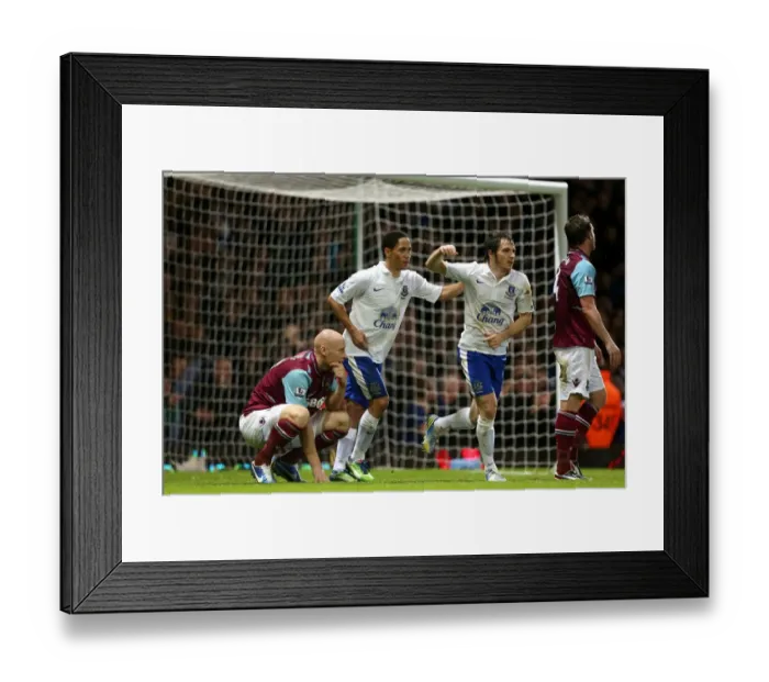 Framed Print : Everton's Double Delight: Pienaar and Baines Celebrate as West Ham Express Disappointment (22-12-2012) Framed Print : Everton's Double Delight: Pienaar and Baines Celebrate as West Ham Express Disappointment (22-12-2012)