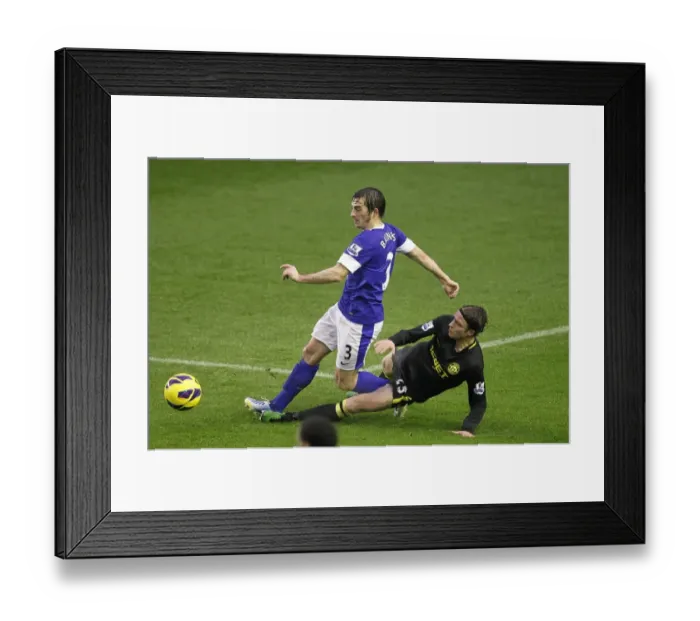 Framed Print : Baines vs. Stam: Everton's Intense Battle Against Wigan Athletic at Goodison Park Framed Print : Baines vs. Stam: Everton's Intense Battle Against Wigan Athletic at Goodison Park