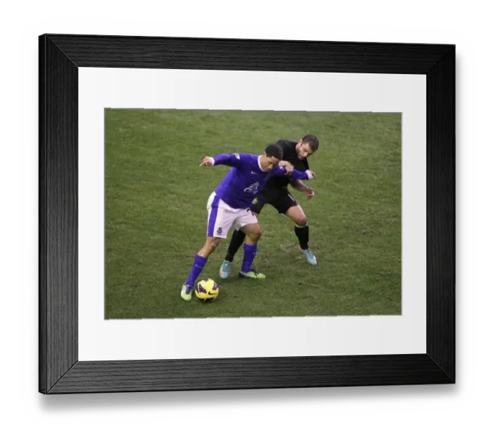 Framed Print : Battle for the Ball: Pienaar vs. Maloney at Goodison Park - Everton's Hard-Fought Victory (2-1 vs. Wigan Athletic, Barclays Premier League) Framed Print : Battle for the Ball: Pienaar vs. Maloney at Goodison Park - Everton's Hard-Fought Victory (2-1 vs. Wigan Athletic, Barclays Premier League)