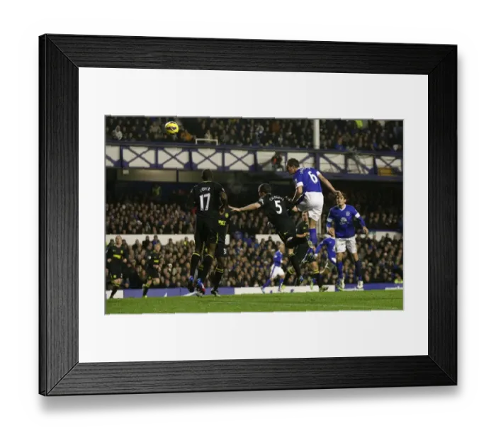 Framed Print : Phil Jagielka's Headed Goal: Everton's Second against Wigan Athletic (December 26, 2012, Goodison Park) Framed Print : Phil Jagielka's Headed Goal: Everton's Second against Wigan Athletic (December 26, 2012, Goodison Park)