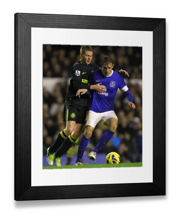 Framed Print : Battle for the Ball: McCarthy vs. Jelavic at Goodison Park - Everton vs. Wigan Athletic (December 26, 2012: Everton 2-1) Framed Print : Battle for the Ball: McCarthy vs. Jelavic at Goodison Park - Everton vs. Wigan Athletic (December 26, 2012: Everton 2-1)