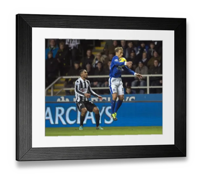 Framed Print : Phil Neville Fends Off Sylvain Marveaux: Everton's Narrow Victory at Newcastle United (Barclays Premier League, St. James Park, 02-01-2013) Framed Print : Phil Neville Fends Off Sylvain Marveaux: Everton's Narrow Victory at Newcastle United (Barclays Premier League, St. James Park, 02-01-2013)